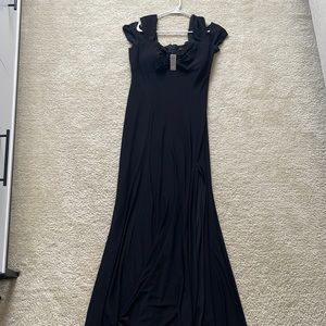 Black tie dress. Size 12. Worn once. Slit on left leg.